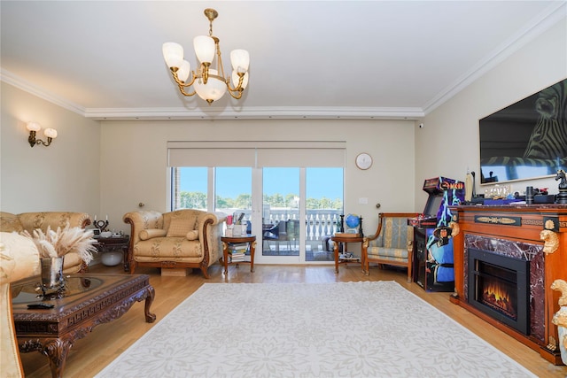 2314 National Dr, Brooklyn, NY 11234 - living area featuring crown molding, light wood-style floors, a glass covered fireplace, and a chandelier