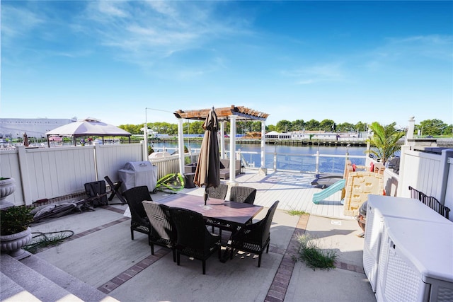 2314 National Dr, Brooklyn, NY 11234 - view of patio / terrace featuring fence, a boat dock, outdoor dining space, a water view, and a playground