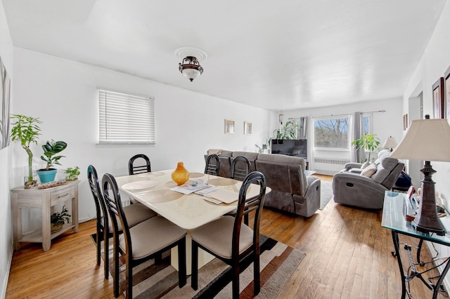 54-30 Kissena Blvd, Flushing, NY 11355 - dining room with radiator and light wood-style flooring