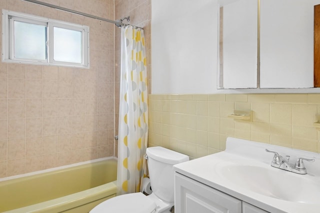 54-30 Kissena Blvd, Flushing, NY 11355 - bathroom featuring a wainscoted wall, toilet, vanity, shower / bathtub combination with curtain, and tile walls