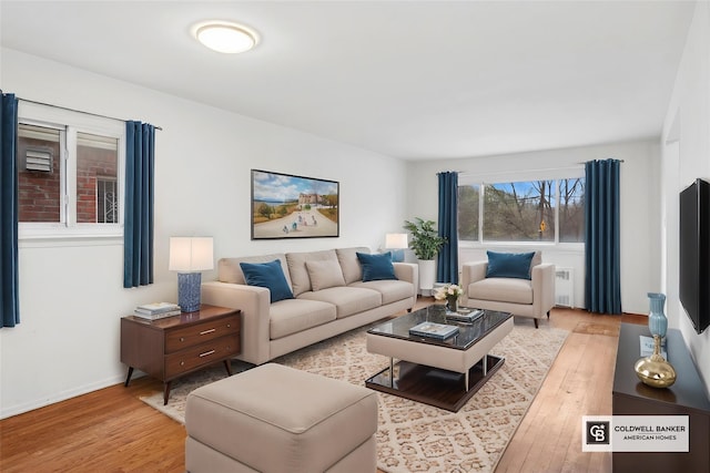54-30 Kissena Blvd, Flushing, NY 11355 - living room featuring baseboards and light wood-style floors