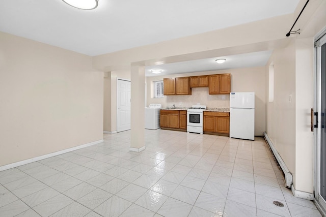 54-30 Kissena Blvd, Flushing, NY 11355 - kitchen with light countertops, a baseboard radiator, brown cabinetry, washer / dryer, and white appliances