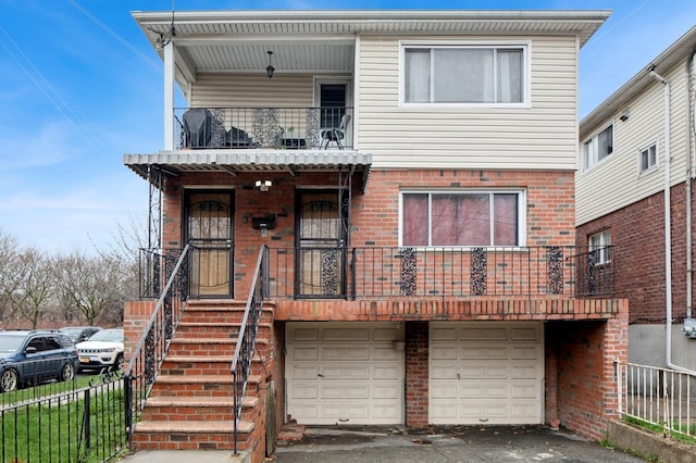 54-30 Kissena Blvd, Flushing, NY 11355 - view of front of home featuring driveway, fence, a garage, a balcony, and a porch