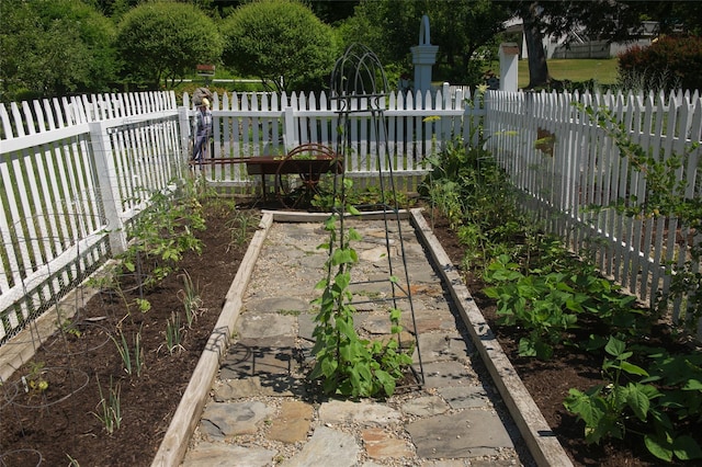 view of yard with a garden and fence