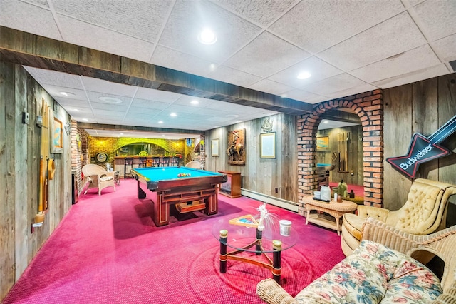 game room with wood walls, carpet flooring, a drop ceiling, pool table, and baseboard heating