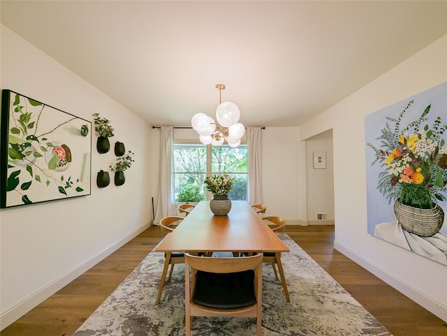 1 Concord Dr, Fort Salonga, NY 11768 - dining room with a chandelier, wood finished floors, and baseboards