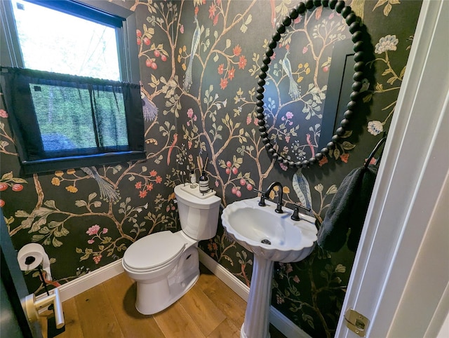 1 Concord Dr, Fort Salonga, NY 11768 - half bath with baseboards, wood finished floors, toilet, and wallpapered walls