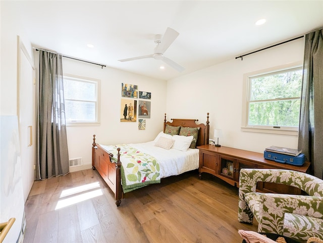 1 Concord Dr, Fort Salonga, NY 11768 - bedroom with multiple windows, light wood-style flooring, recessed lighting, and a ceiling fan