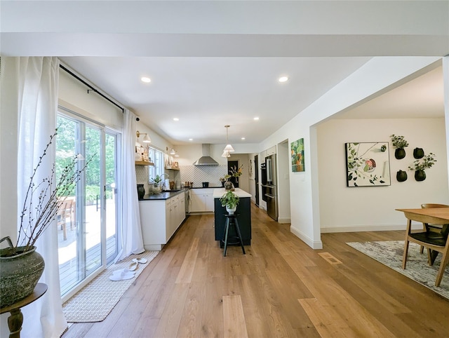 1 Concord Dr, Fort Salonga, NY 11768 - kitchen with wall chimney exhaust hood, backsplash, a kitchen island, recessed lighting, and light wood-type flooring