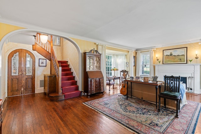 3 Wincoma Dr, Huntington Bay, NY 11743 - entrance foyer with wood-type flooring, arched walkways, stairway, and ornamental molding