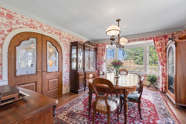 3 Wincoma Dr, Huntington Bay, NY 11743 - dining room with dark wood finished floors, wallpapered walls, and ornamental molding