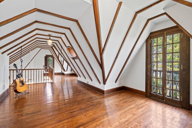 3 Wincoma Dr, Huntington Bay, NY 11743 - bonus room with vaulted ceiling, wood finished floors, and a healthy amount of sunlight