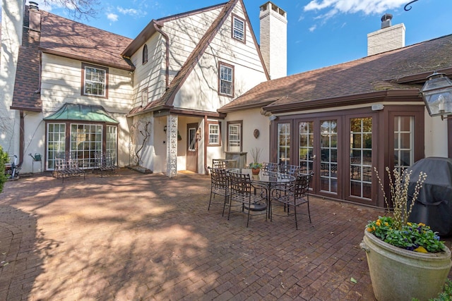 3 Wincoma Dr, Huntington Bay, NY 11743 - back of house featuring a chimney, stucco siding, a patio, and french doors
