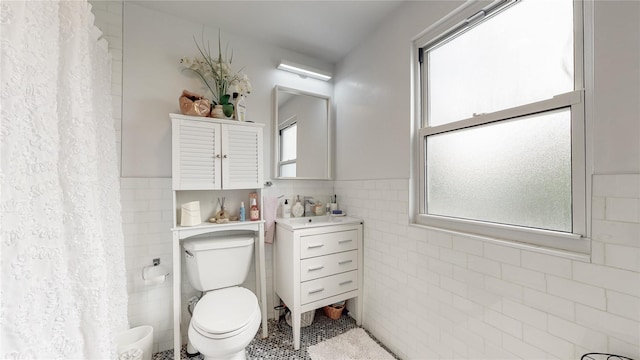 138-07 232nd St, Laurelton, NY 11413 - full bathroom with toilet, vanity, wainscoting, and tile walls