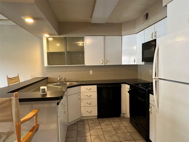 35 Bailey Ct Unit 35, Middle Island, NY 11953 - kitchen featuring black appliances, a sink, dark countertops, and light tile patterned floors