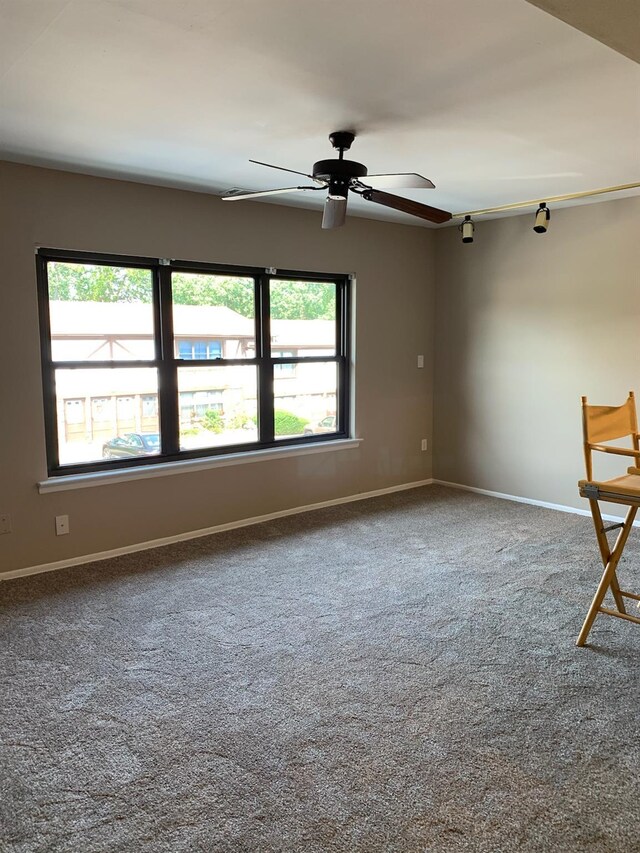 35 Bailey Ct Unit 35, Middle Island, NY 11953 - carpeted spare room featuring plenty of natural light, baseboards, and ceiling fan