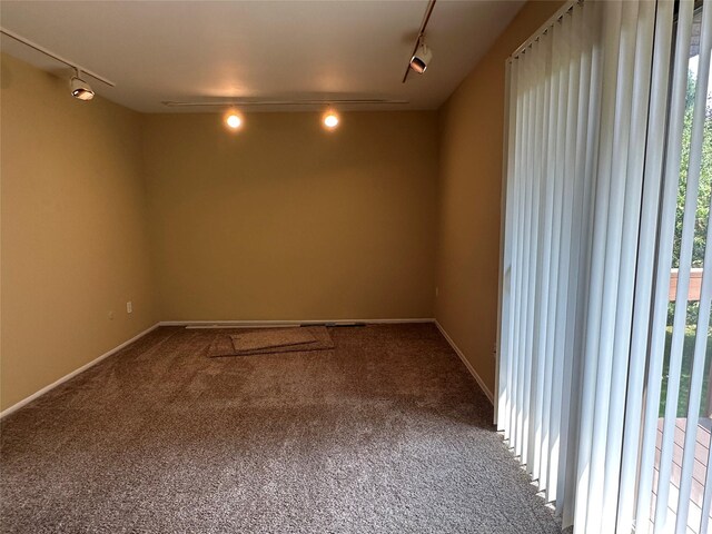 35 Bailey Ct Unit 35, Middle Island, NY 11953 - carpeted empty room featuring rail lighting and baseboards