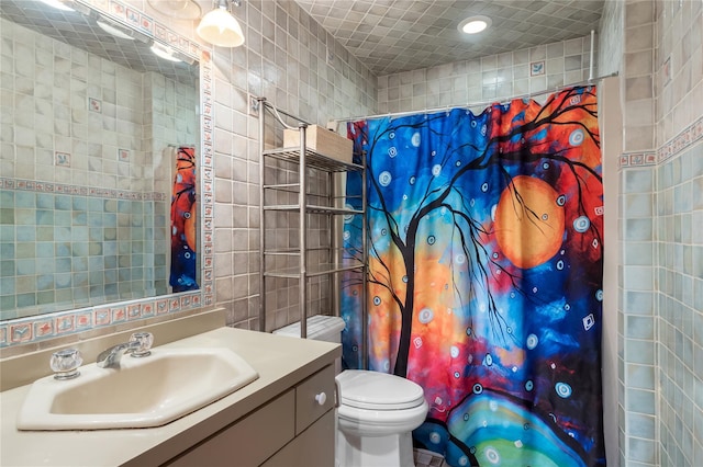 full bath featuring tile walls, vanity, curtained shower, toilet, and recessed lighting