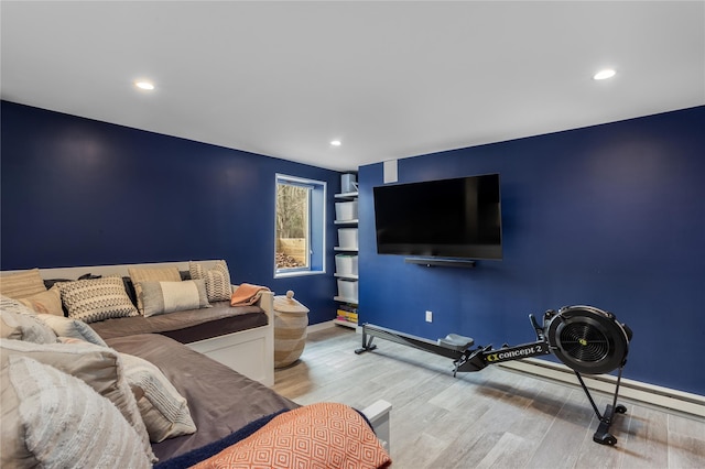 living area with wood finished floors, recessed lighting, and baseboards