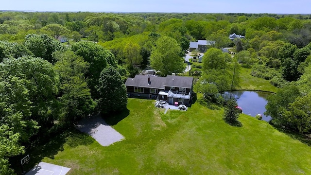 bird's eye view of a heavily wooded area and a large body of water