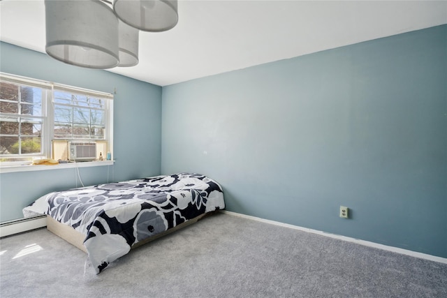 bedroom with baseboard heating, baseboards, carpet flooring, and cooling unit