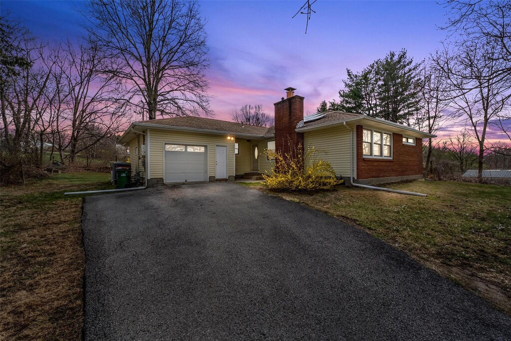254 Myers Corners Rd, Wappingers Falls, NY 12590 - ranch-style home featuring driveway, a lawn, a garage, and a chimney