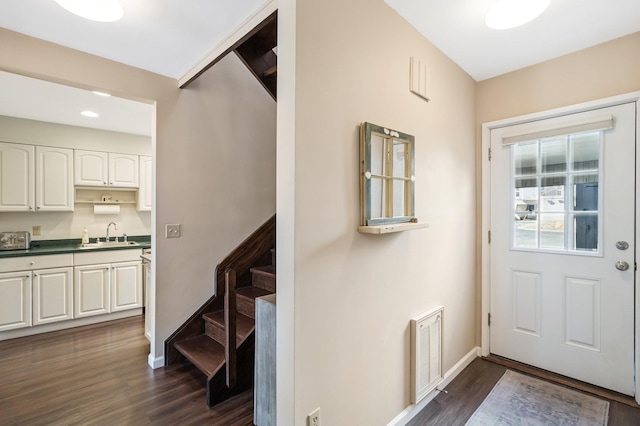 29 Fairway Pl Unit 14, Montauk, NY 11954 - doorway to outside with a sink, dark wood finished floors, baseboards, and stairs