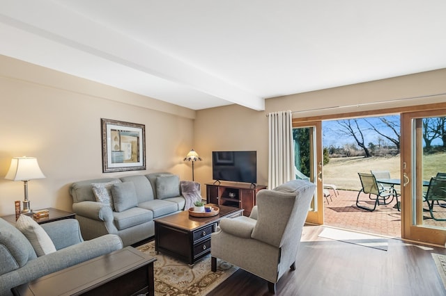 29 Fairway Pl Unit 14, Montauk, NY 11954 - living room with wood finished floors and beamed ceiling