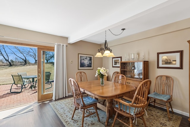 29 Fairway Pl Unit 14, Montauk, NY 11954 - dining area with dark wood-style flooring, beamed ceiling, baseboards, and a notable chandelier