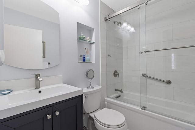 29 Fairway Pl Unit 14, Montauk, NY 11954 - bathroom featuring toilet, vanity, and enclosed tub / shower combo