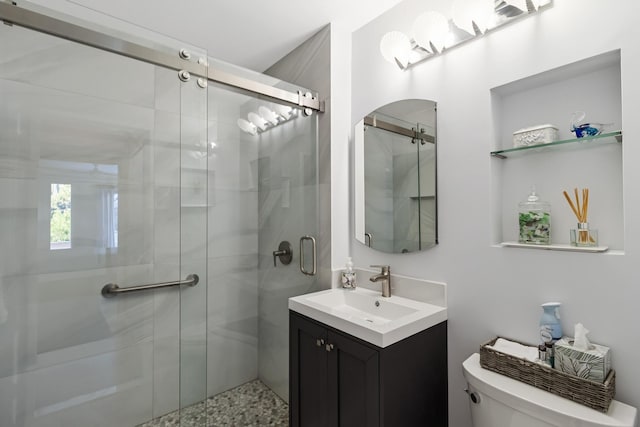29 Fairway Pl Unit 14, Montauk, NY 11954 - bathroom featuring vanity, toilet, and a shower stall