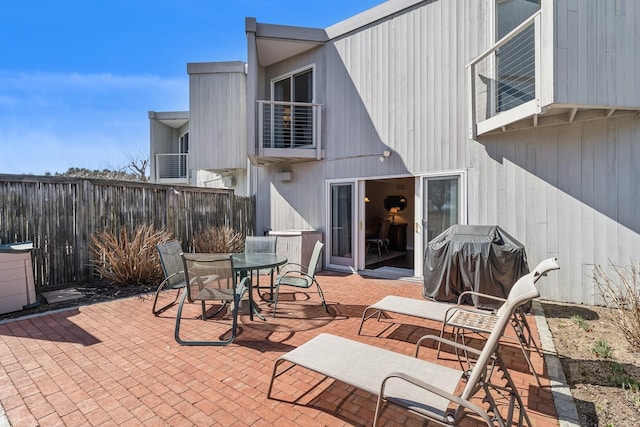 29 Fairway Pl Unit 14, Montauk, NY 11954 - view of patio / terrace featuring a balcony, outdoor dining space, area for grilling, and fence