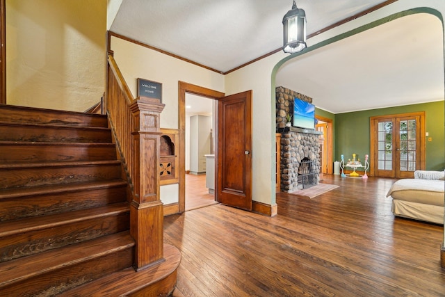 12 Sunset View Dr, West Nyack, NY 10994 - living room with a stone fireplace, stairway, french doors, crown molding, and wood-type flooring