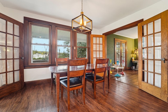 12 Sunset View Dr, West Nyack, NY 10994 - dining space with dark wood-type flooring, french doors, baseboards, and a notable chandelier