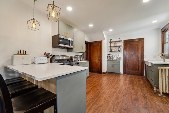 12 Sunset View Dr, West Nyack, NY 10994 - kitchen with stainless steel appliances, a peninsula, radiator heating unit, and gray cabinets