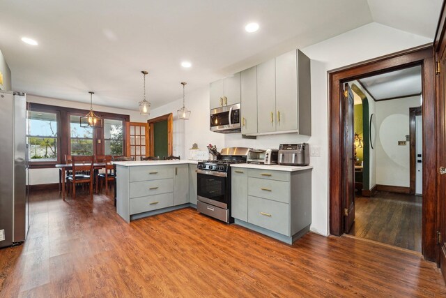 12 Sunset View Dr, West Nyack, NY 10994 - kitchen featuring dark wood-type flooring, a peninsula, stainless steel appliances, gray cabinetry, and baseboards