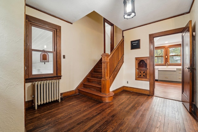 12 Sunset View Dr, West Nyack, NY 10994 - stairs featuring radiator heating unit, baseboards, hardwood / wood-style floors, and crown molding