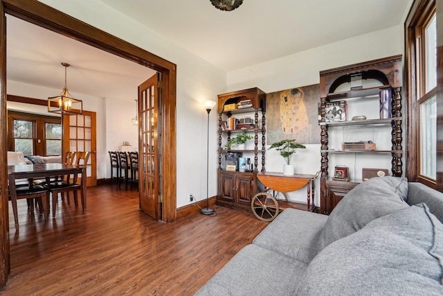 12 Sunset View Dr, West Nyack, NY 10994 - living room featuring baseboards, a chandelier, and wood finished floors