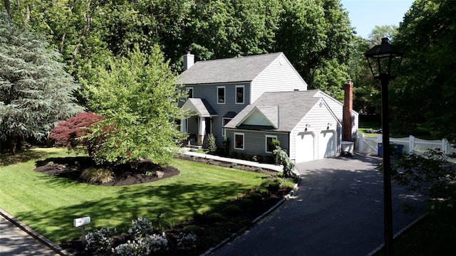 3 Samuels Path, Miller Place, NY 11764 - view of front facade featuring driveway, a chimney, and an attached garage