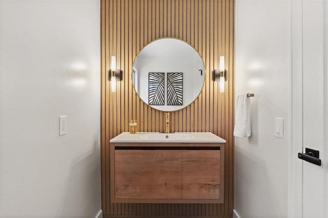 bathroom with vanity and baseboards