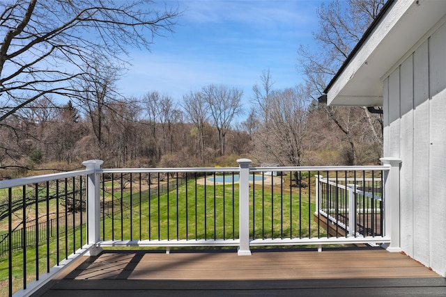 wooden deck with a lawn