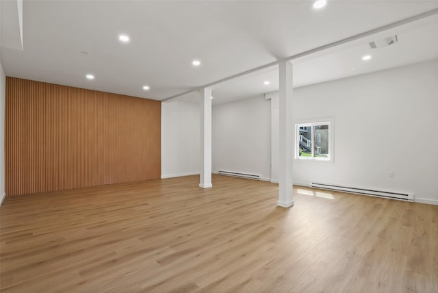 below grade area with recessed lighting and baseboard heating