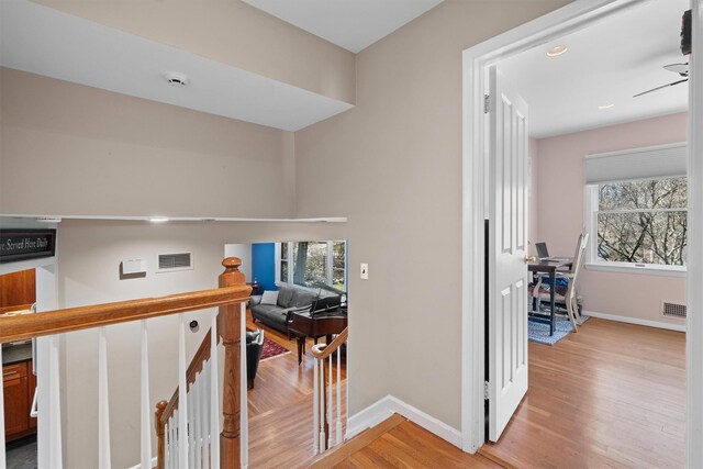 21 Glengary Rd, Croton-On-Hudson, NY 10520 - hallway featuring light wood-style flooring, visible vents, baseboards, and an upstairs landing
