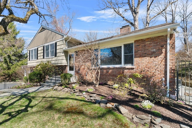 21 Glengary Rd, Croton-On-Hudson, NY 10520 - split level home featuring a chimney, a front yard, and brick siding