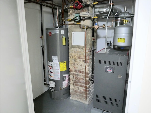 utility room with water heater and a heating unit