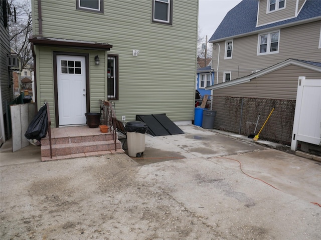 rear view of property with fence