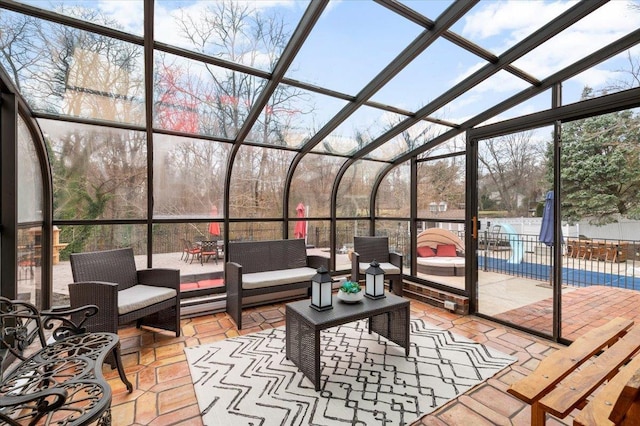 sunroom with an outdoor living space