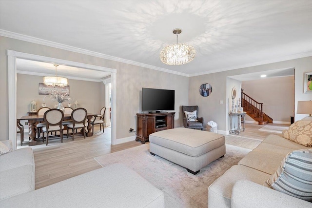 living area featuring light wood finished floors, stairs, a notable chandelier, and crown molding