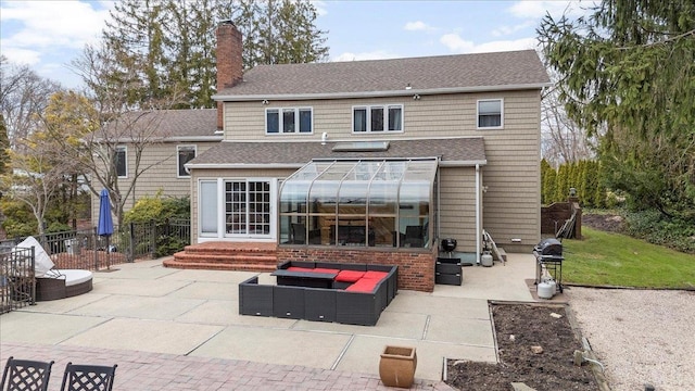 rear view of house with a patio area, roof with shingles, a chimney, fence, and entry steps