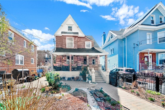 820 S Oak Dr, Bronx, NY 10467 - view of front of home with fence and covered porch